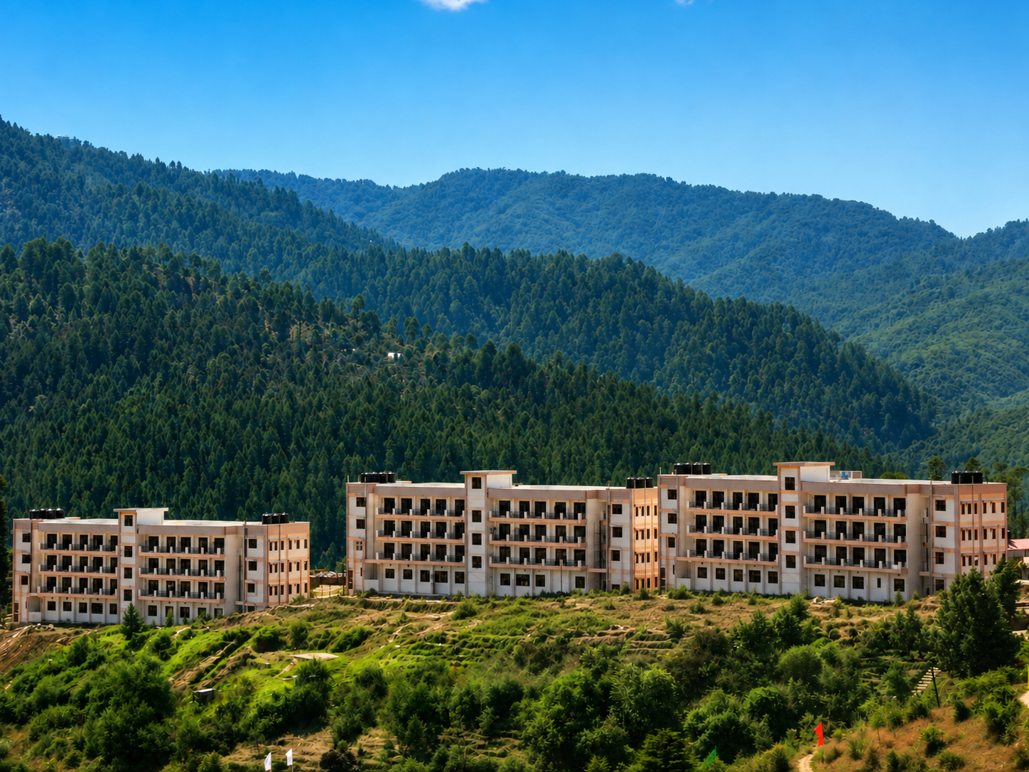 I.T.B.P. barrack blocks set against forested Himalayan hillsides at Lohaghat