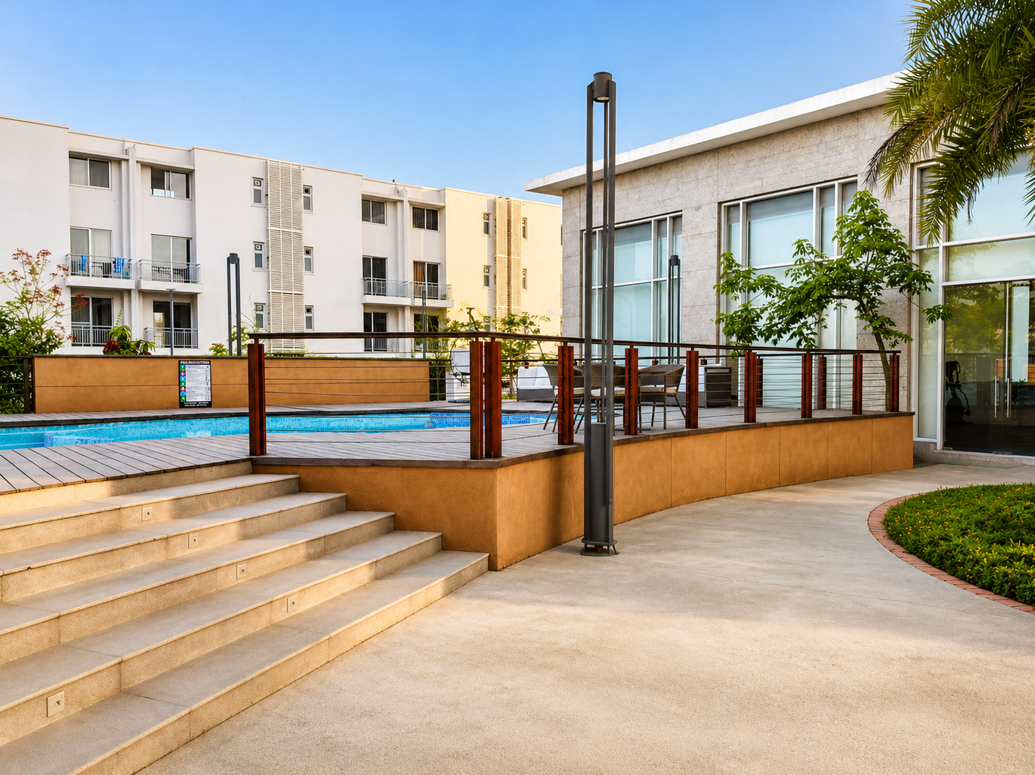 Swimming pool with timber deck, stone steps and hardscape paving