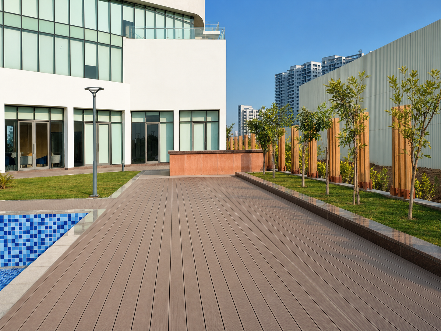 Composite timber deck alongside the swimming pool and clubhouse facade