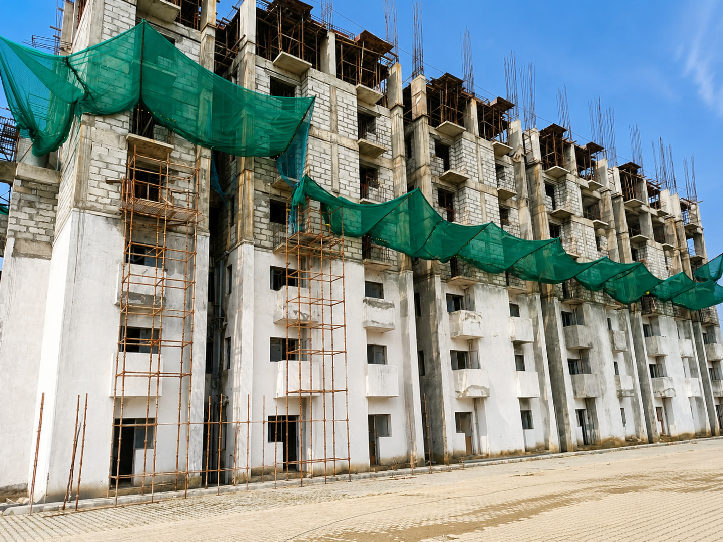 Residential blocks with scaffolding and safety netting during construction
