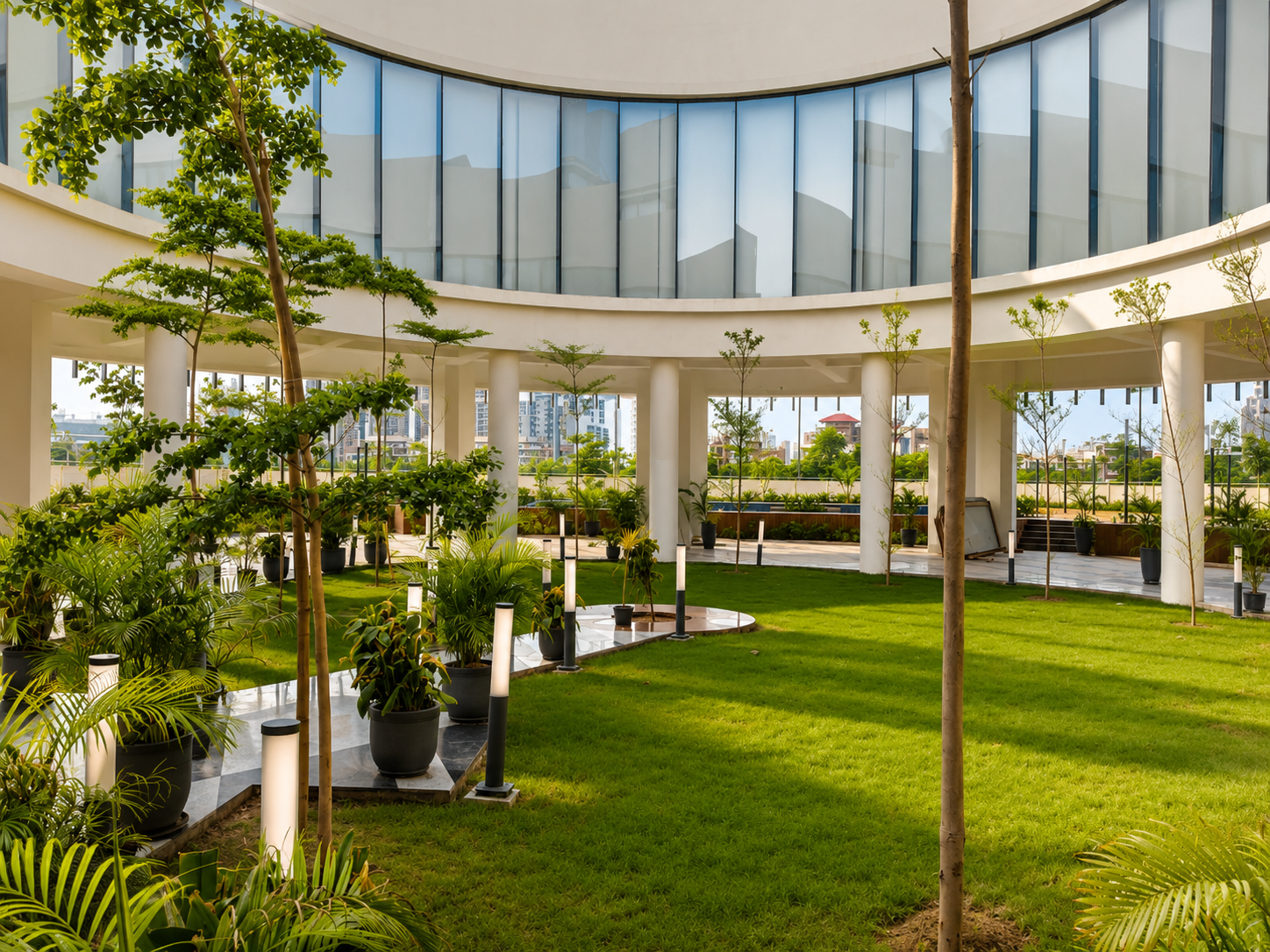 Landscaped central courtyard beneath the circular glazed volume