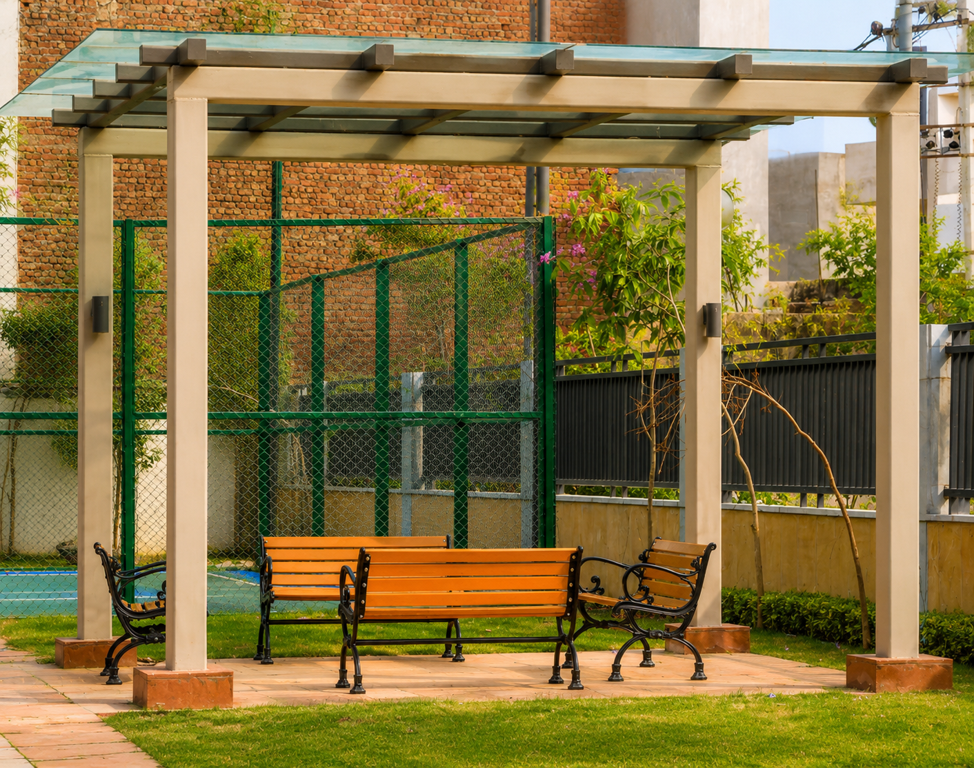 Landscaped seating pergola and hardscape area at Godrej Summit