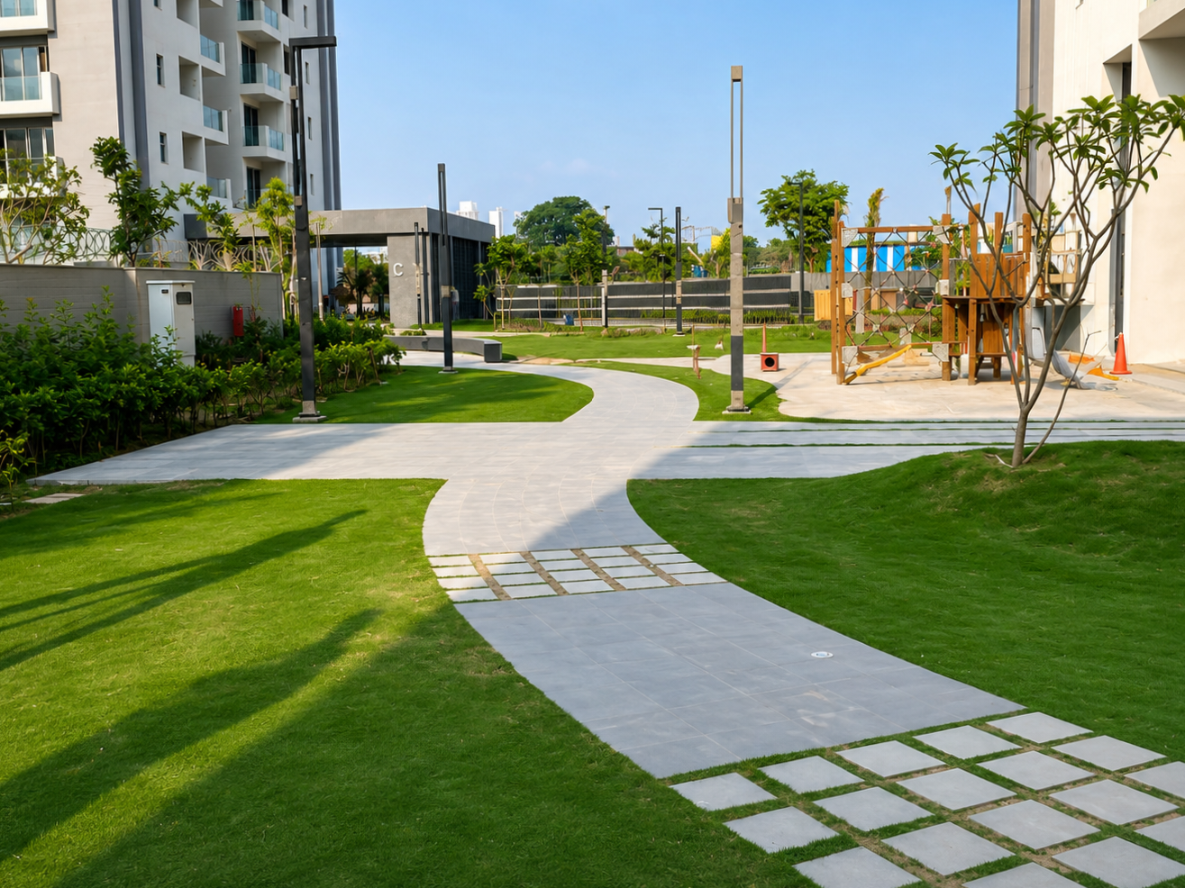 Paved pathways and landscaped lawns between residential towers