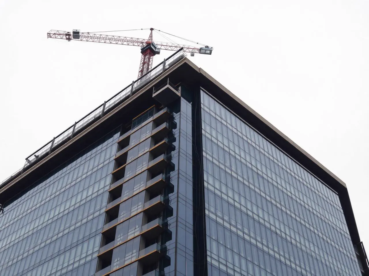 Early-stage building construction with concrete frame and scaffolding